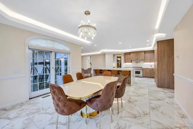 a bathroom with a granite countertop tub sink and mirror