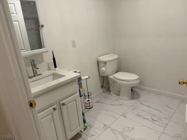 a view of a kitchen from the hallway