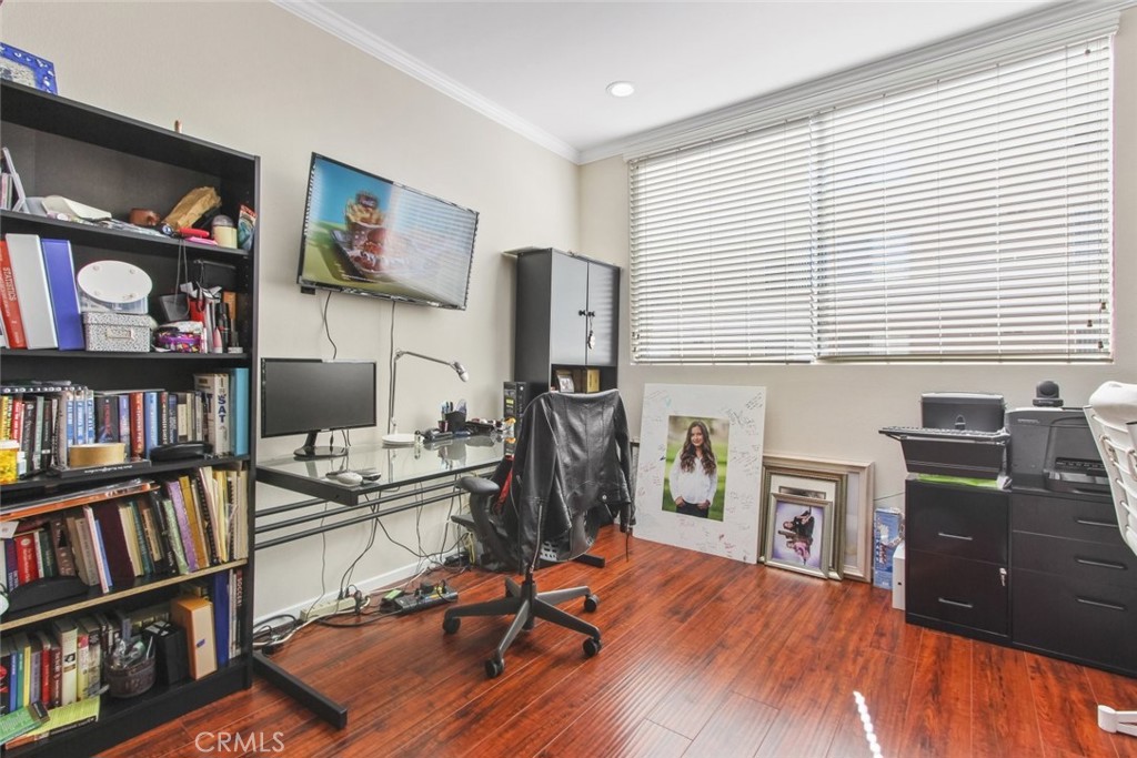 4655 Natick Avenue, Unit 3 Sherman Oaks, CA 91403 - Photo 12 of 25 a view of a workspace with furniture and a bookshelf