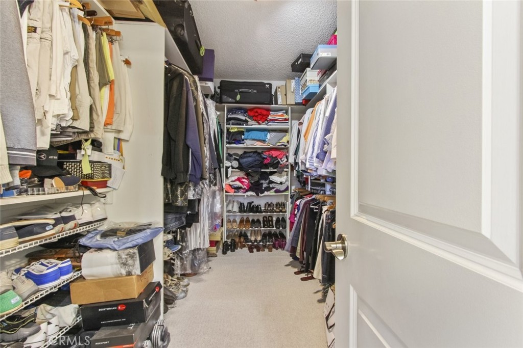 4655 Natick Avenue, Unit 3 Sherman Oaks, CA 91403 - Photo 17 of 25 a view of walk in closet with clothes and shoes