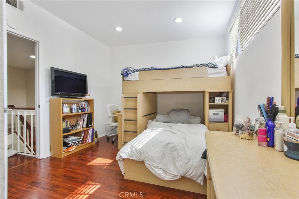 4655 Natick Avenue, Unit 3 Sherman Oaks, CA 91403 - Photo 19 of 25 a bedroom with furniture and a flat screen tv