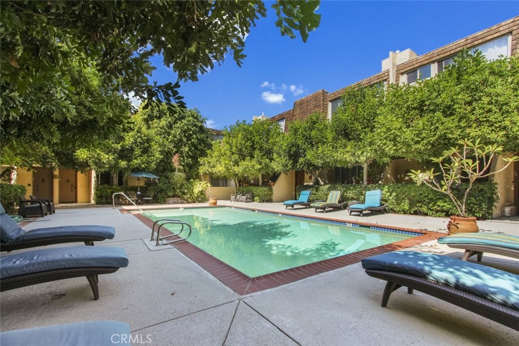 4655 Natick Avenue, Unit 3 Sherman Oaks, CA 91403 - Photo 22 of 25 a view of a backyard with swimming pool