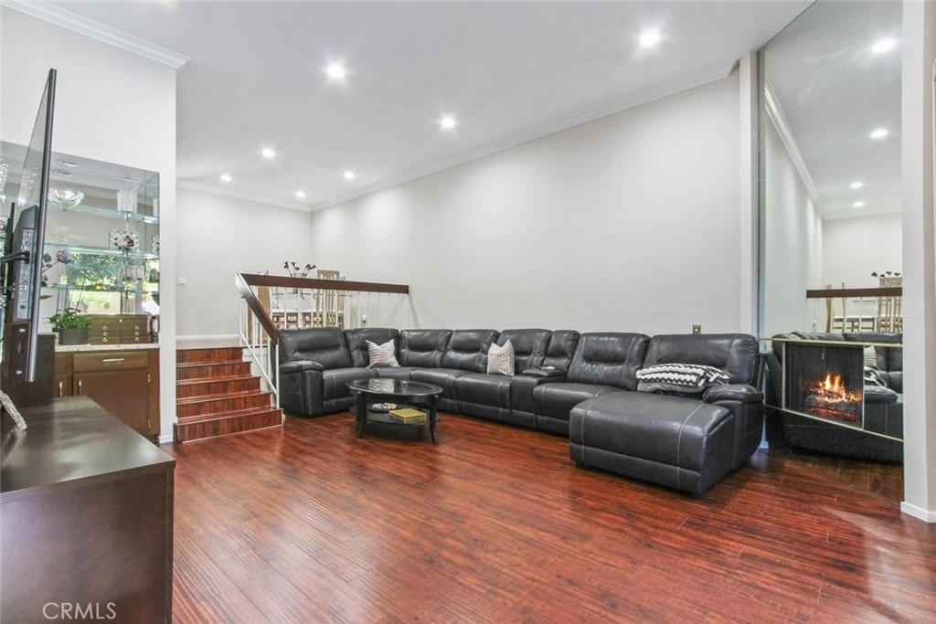 4655 Natick Avenue, Unit 3 Sherman Oaks, CA 91403 - Photo 4 of 25 a living room with furniture and a wooden floor
