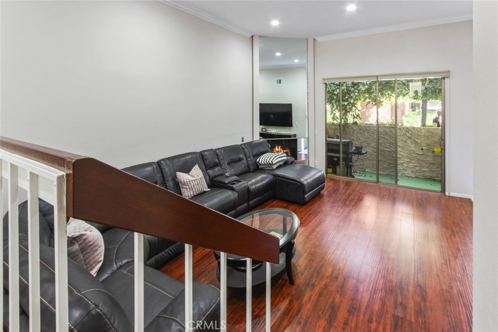 4655 Natick Avenue, Unit 3 Sherman Oaks, CA 91403 - Photo 7 of 25 a living room with furniture and wooden floor
