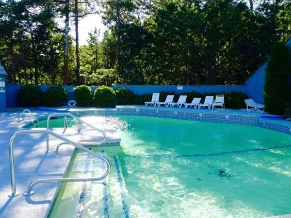 a view of yard with furniture and garden
