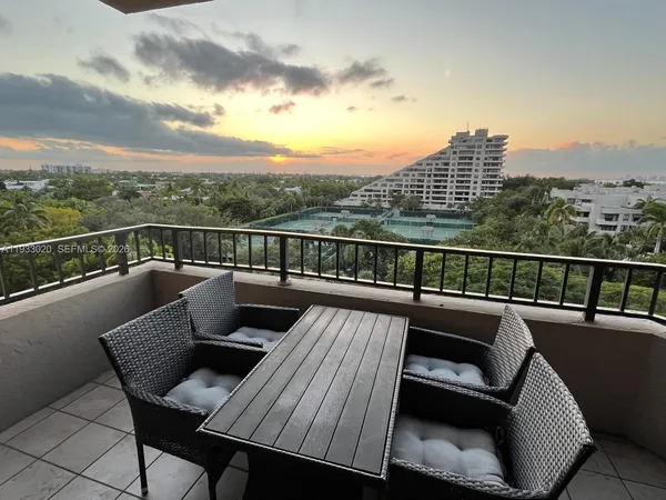 a view of a balcony with furniture