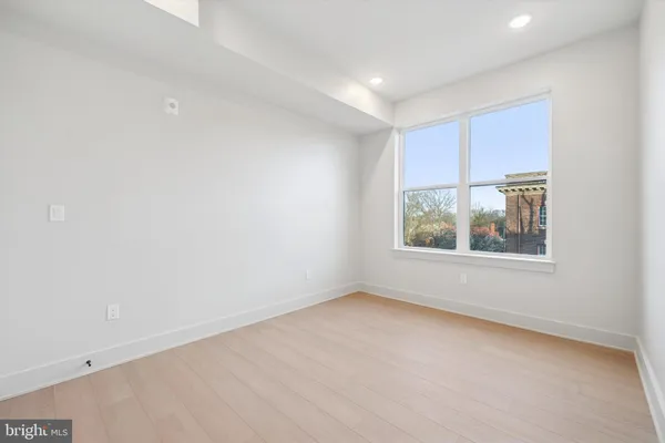 a view of an empty room with a window