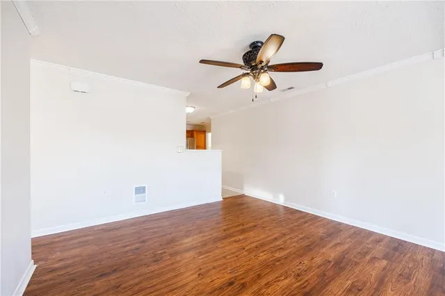 a view of a big room with wooden floor