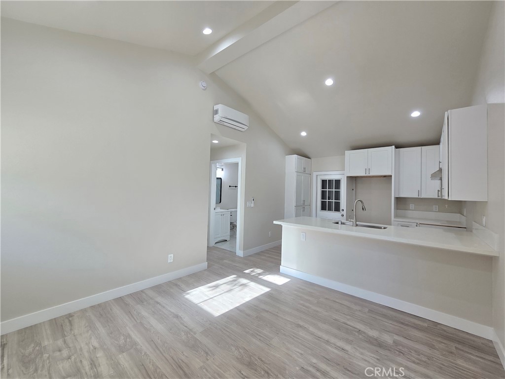 3871 Bandini Avenue Riverside, CA 92506 - Photo 3 of 11 a view of kitchen with wooden floor and electronic appliances
