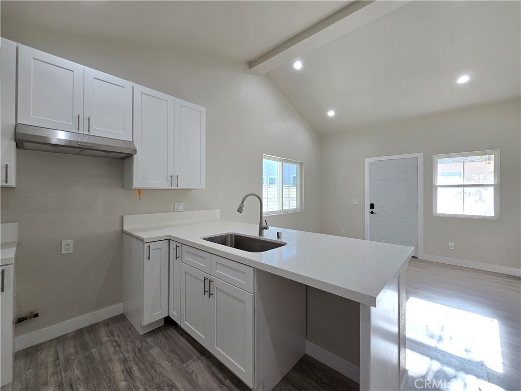 3871 Bandini Avenue Riverside, CA 92506 - Photo 4 of 11 a kitchen with a sink and cabinets