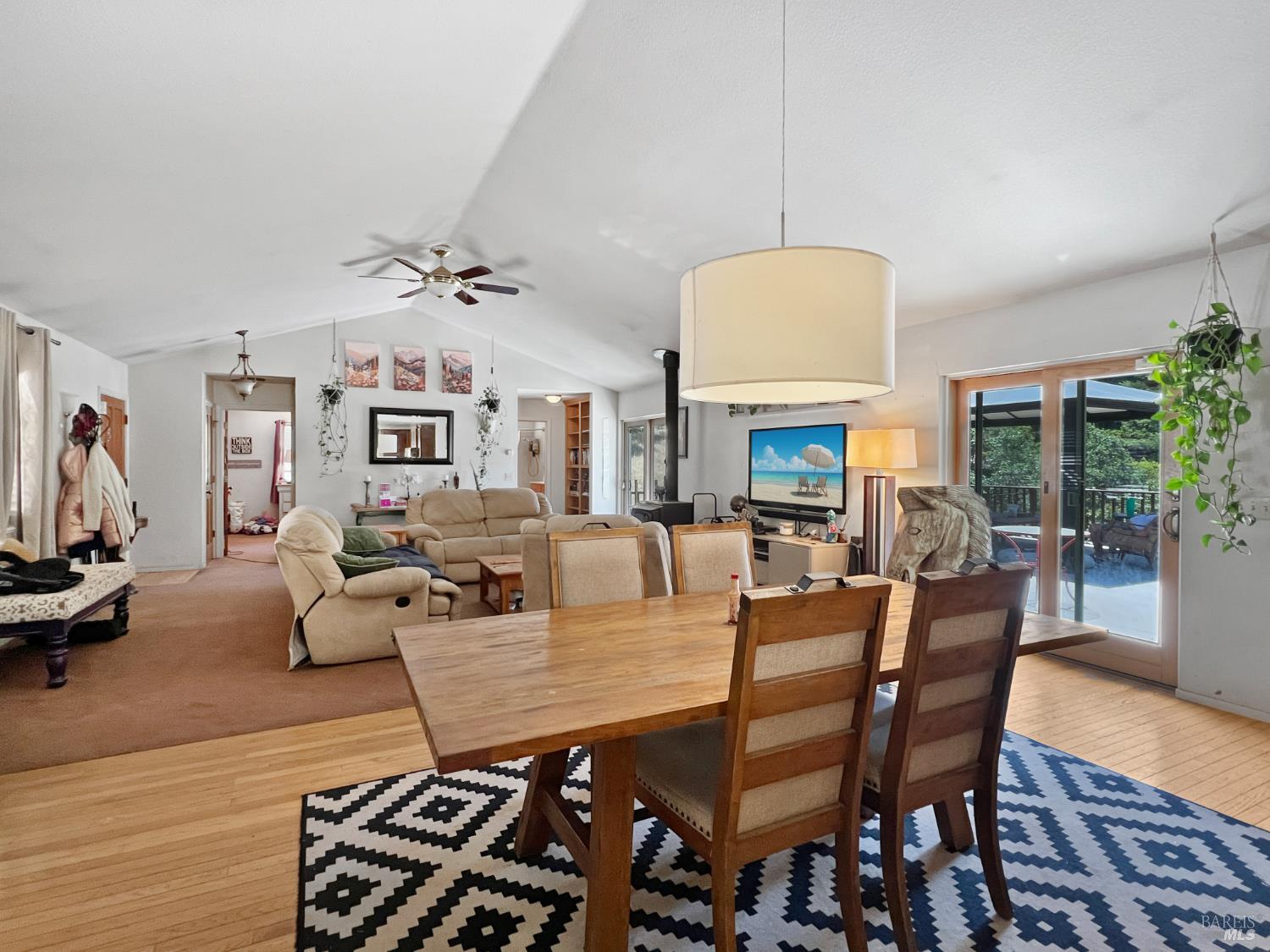 8800 Cave Creek Road Redwood Valley, CA 95470 - Photo 4 of 12 a living room with lots of furniture and a chandelier