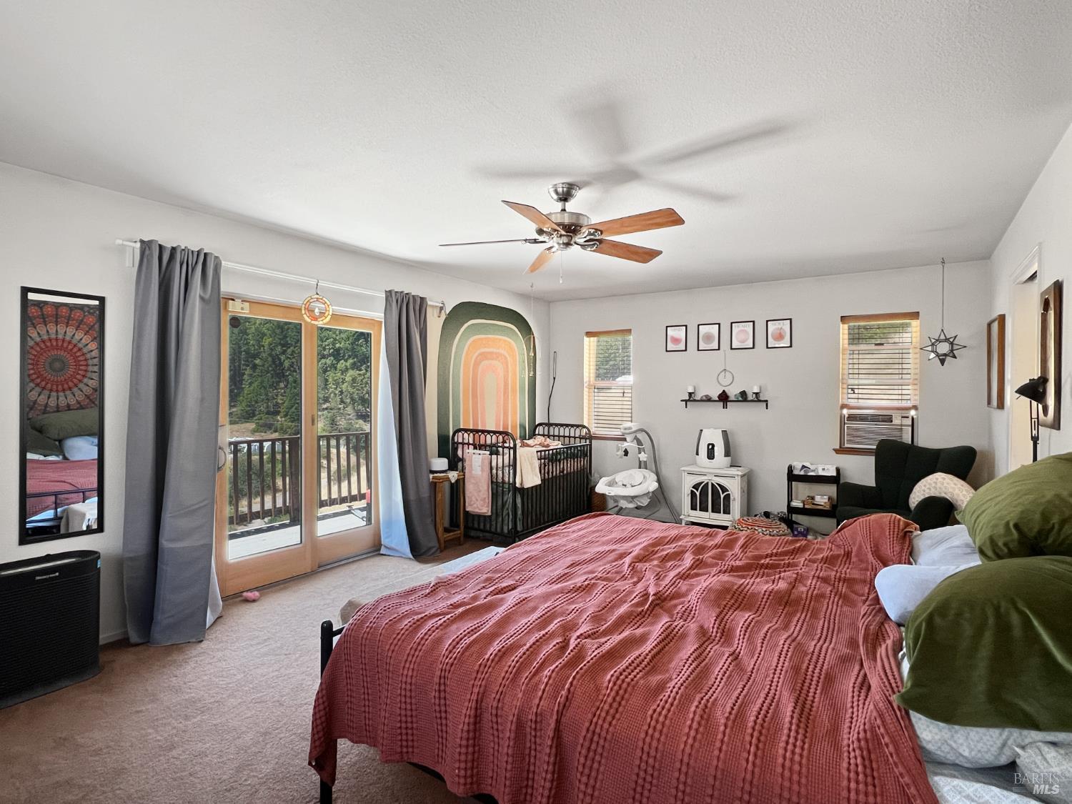 8800 Cave Creek Road Redwood Valley, CA 95470 - Photo 5 of 12 a bed room with a bed and a large window