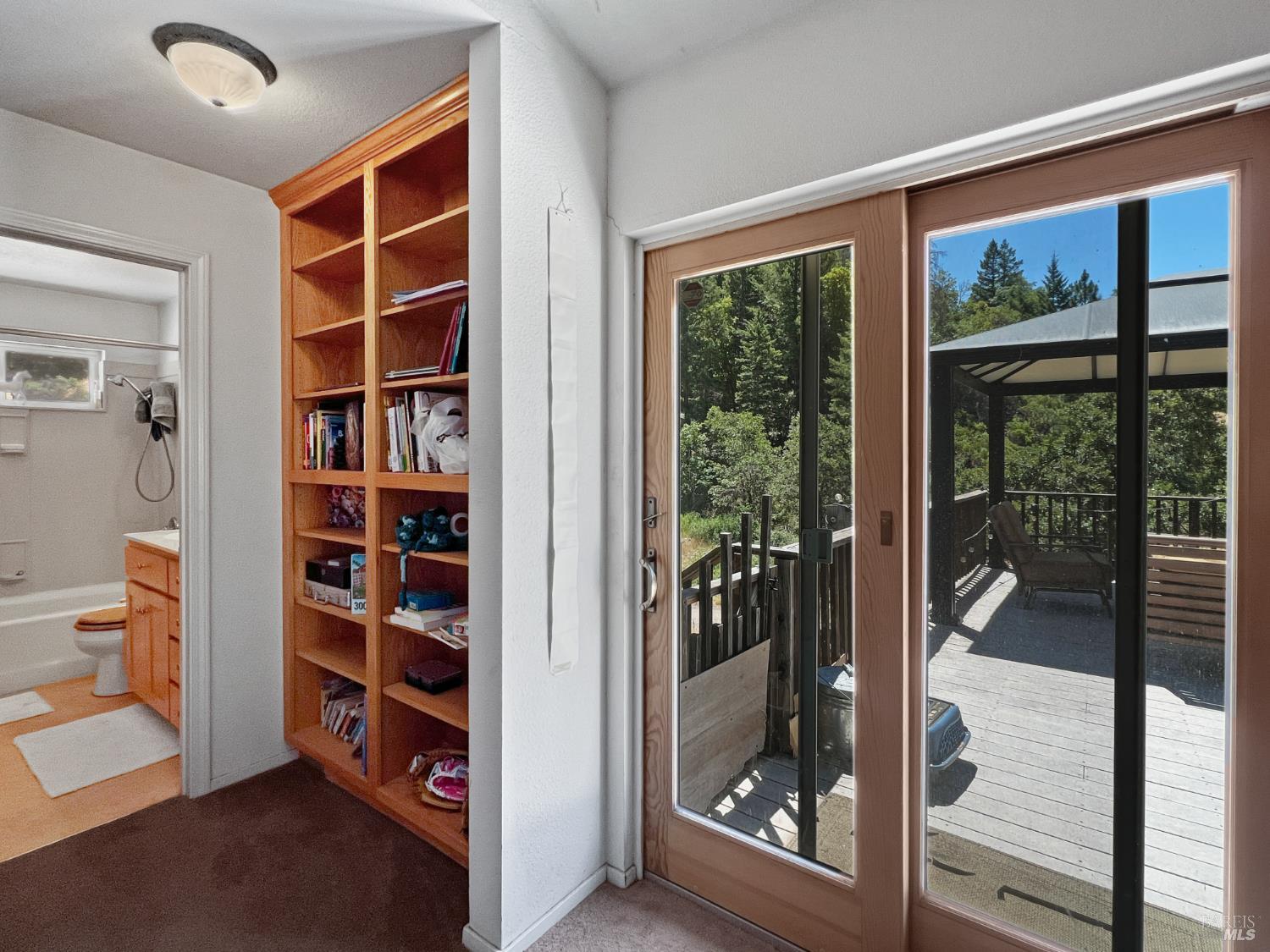8800 Cave Creek Road Redwood Valley, CA 95470 - Photo 6 of 12 a view of walk in closet with clothes and shoes