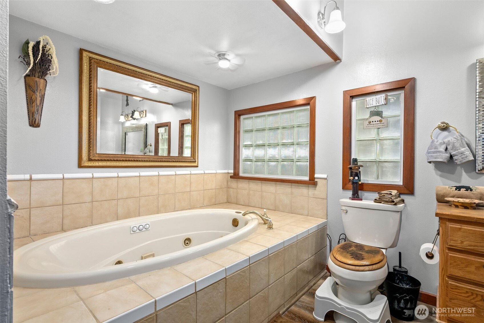 4914 182nd Avenue Southwest Longbranch, WA 98351 - Photo 11 of 37 a bathroom with a bathtub and a window