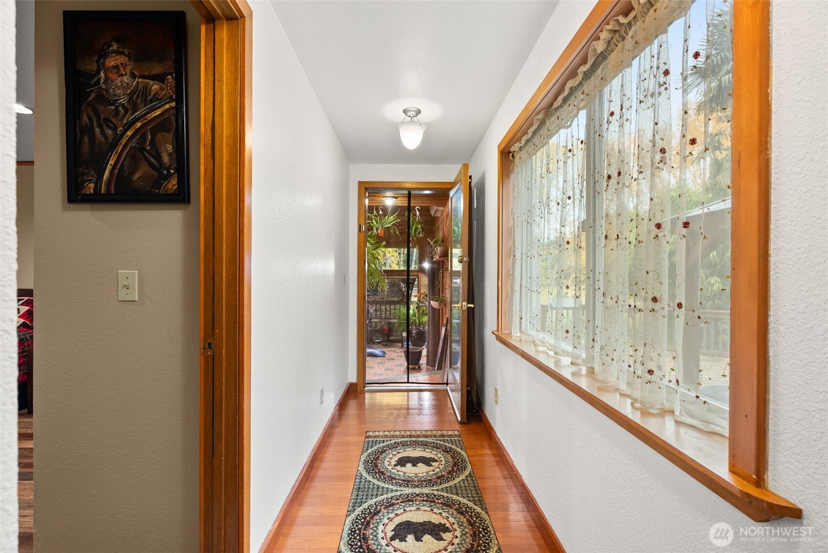 4914 182nd Avenue Southwest Longbranch, WA 98351 - Photo 17 of 37 a view of a hallway with windows
