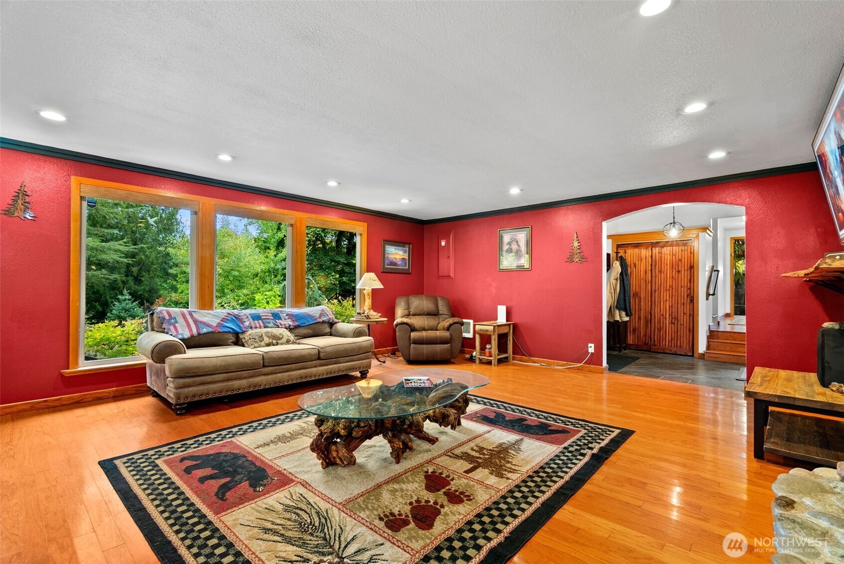 4914 182nd Avenue Southwest Longbranch, WA 98351 - Photo 20 of 37 a living room with furniture a rug and a large window
