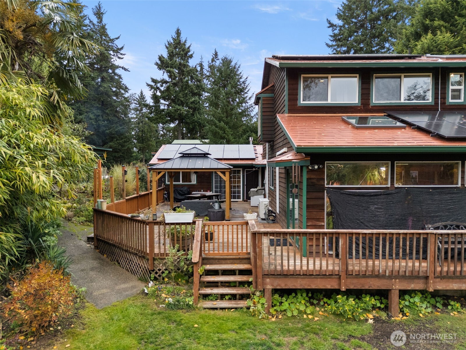 4914 182nd Avenue Southwest Longbranch, WA 98351 - Photo 35 of 37 a front view of a house with a deck