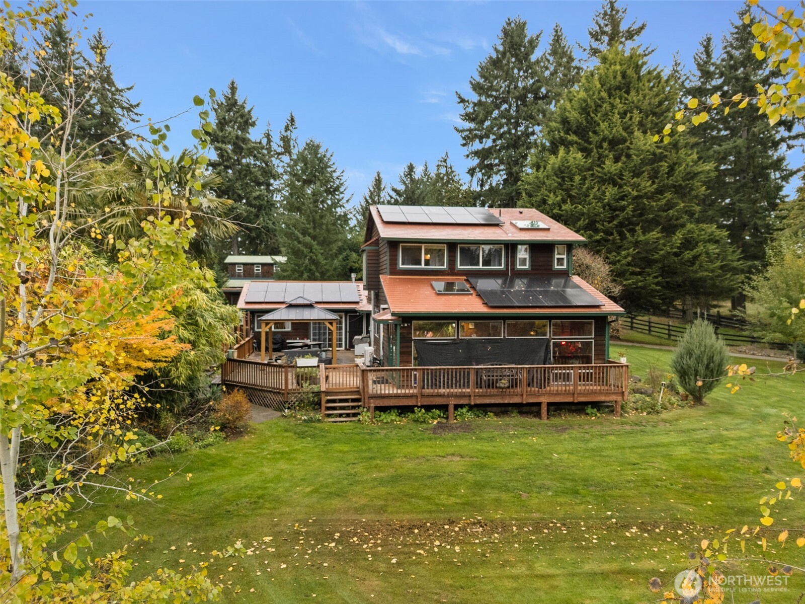 4914 182nd Avenue Southwest Longbranch, WA 98351 - Photo 36 of 37 a front view of a house with a yard