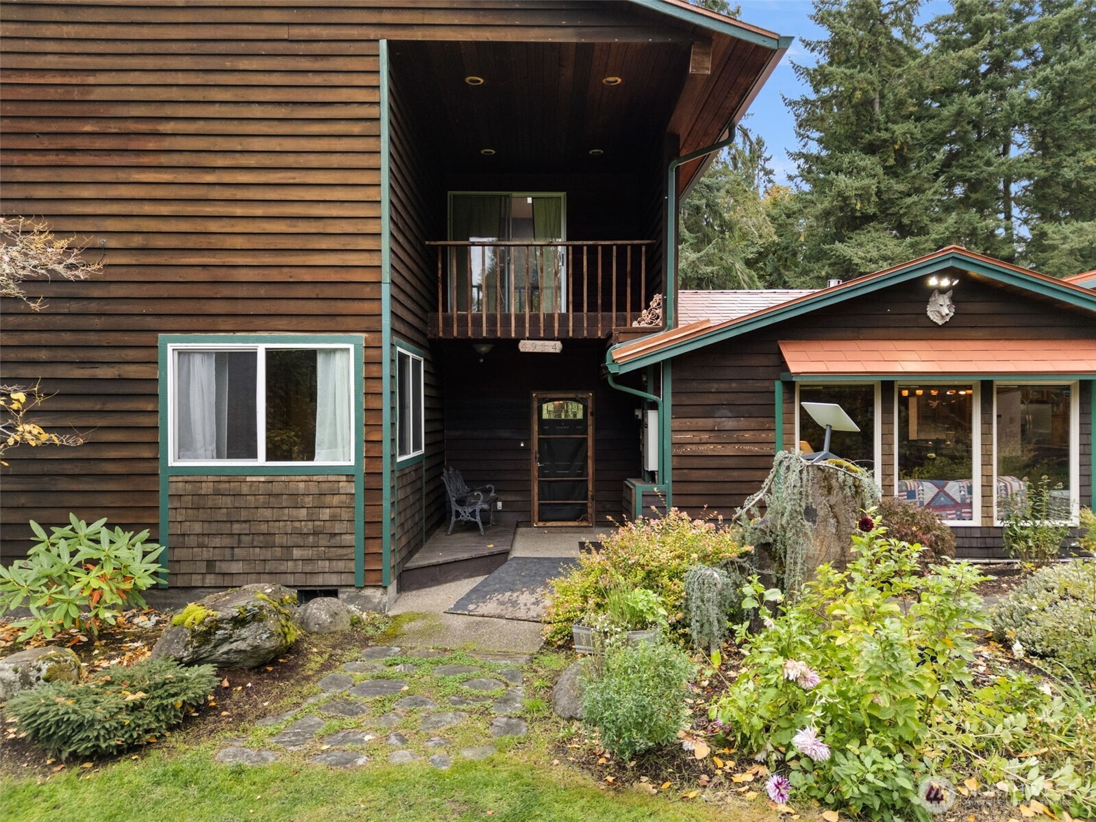 4914 182nd Avenue Southwest Longbranch, WA 98351 - Photo 5 of 37 a front view of a house with garden