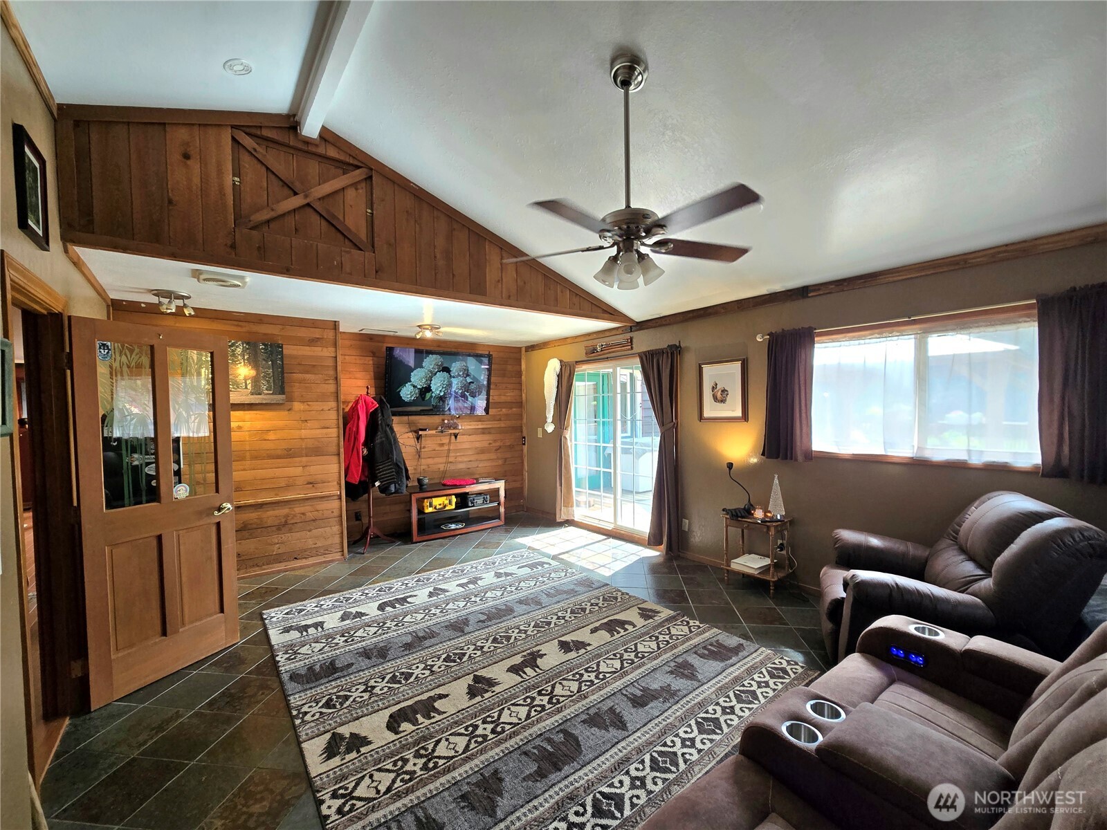 4914 182nd Avenue Southwest Longbranch, WA 98351 - Photo 10 of 37 a living room with furniture and a chandelier