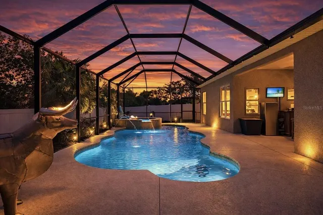 a view of a swimming pool with a patio