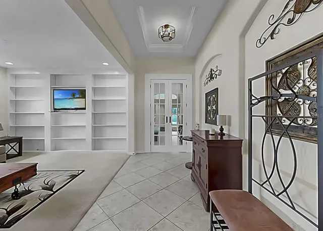 a room with furniture a rug and a window