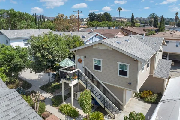 a aerial view of a house with a yard