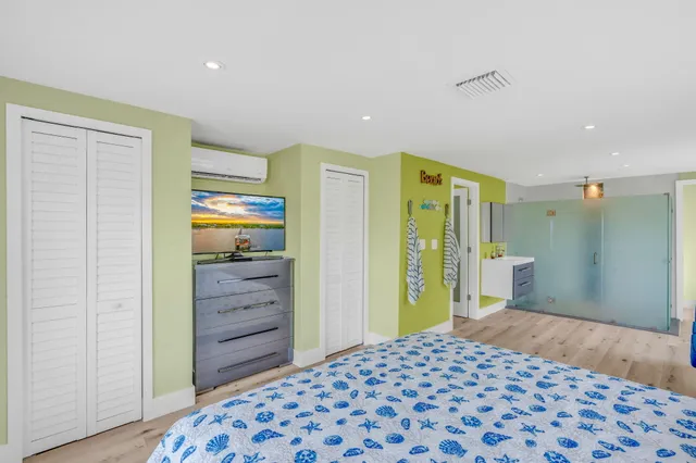 a bedroom with a bed and a couch