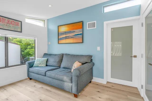 a bathroom with a sink a toilet and shower curtain