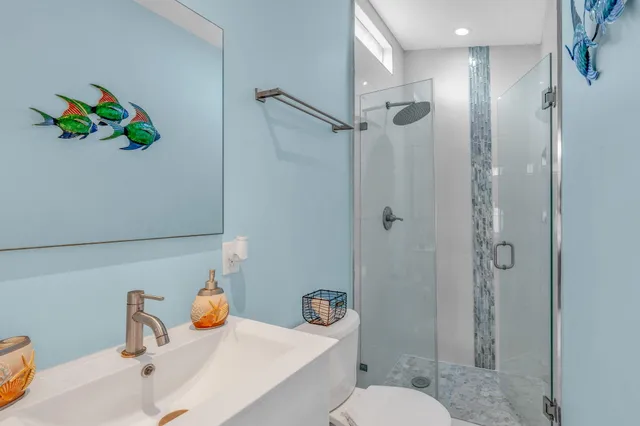 a view of yard with swimming pool and seating