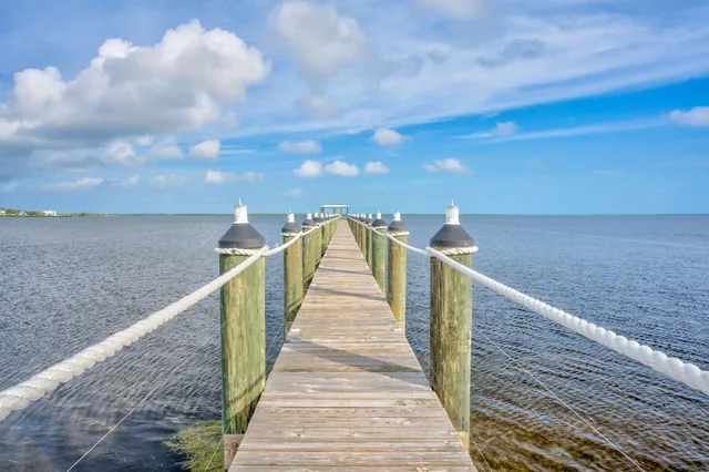 a view of a chairs and table in the patio