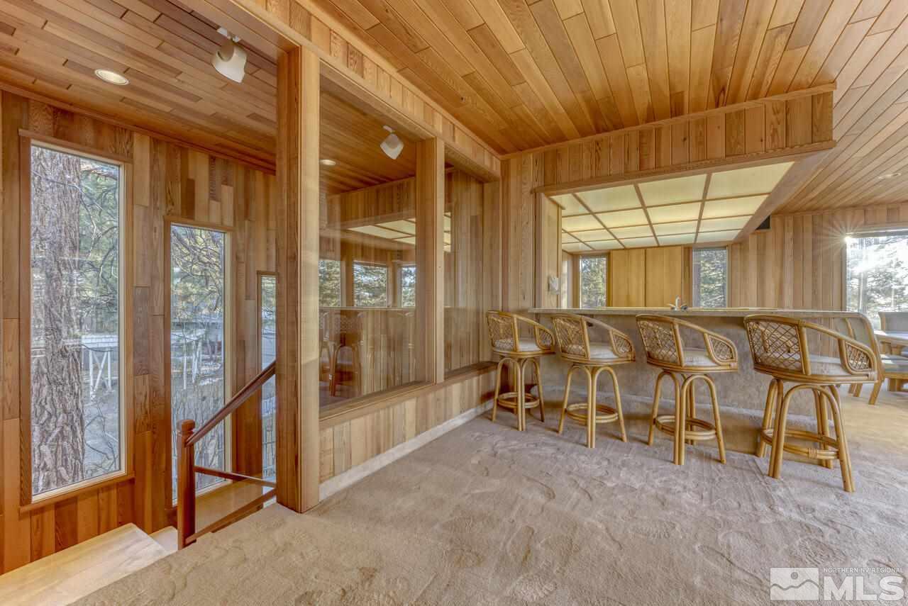 118 Ponderosa Zephyr Cove, NV 89448 - Photo 16 of 31 a room with lots of furniture and a large window