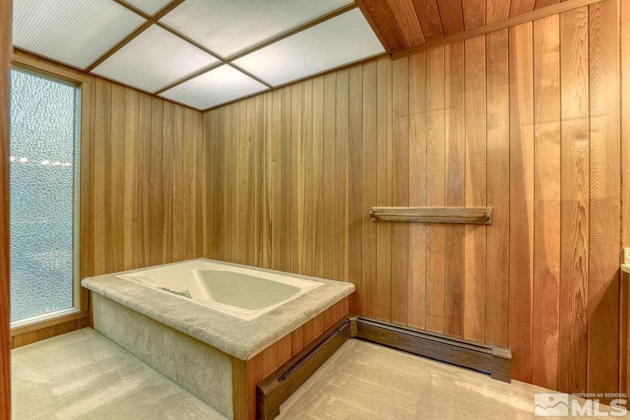 118 Ponderosa Zephyr Cove, NV 89448 - Photo 20 of 31 a bathroom with a tub and shower curtain