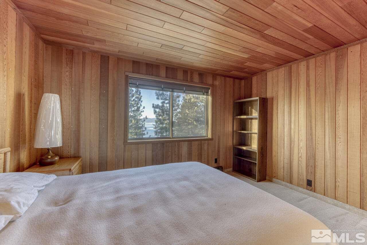 118 Ponderosa Zephyr Cove, NV 89448 - Photo 23 of 31 a bedroom with a bed and a window