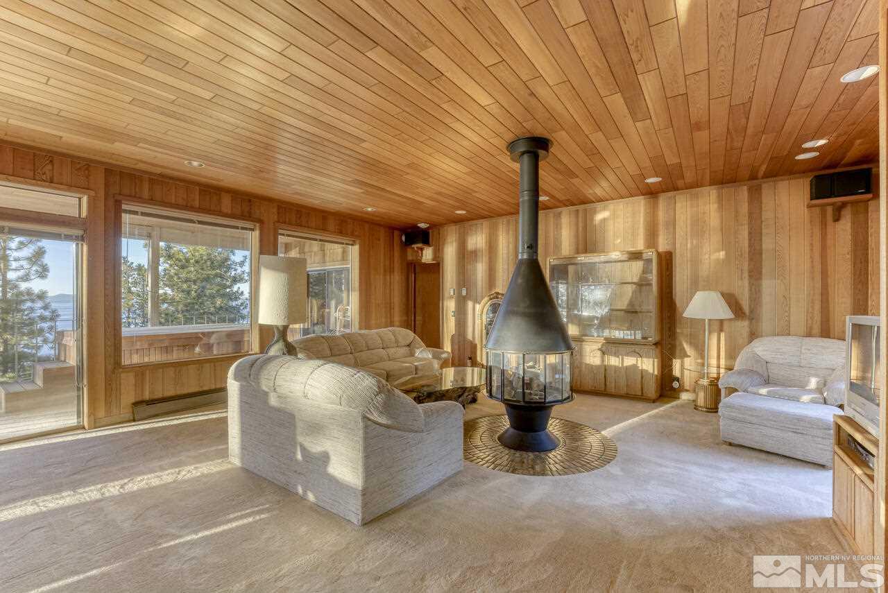 118 Ponderosa Zephyr Cove, NV 89448 - Photo 4 of 31 a living room with couch and a floor to ceiling window
