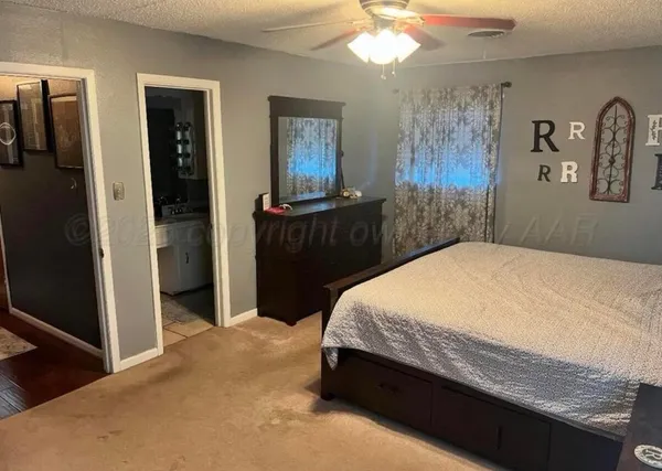 a bedroom with a bed and a mirror