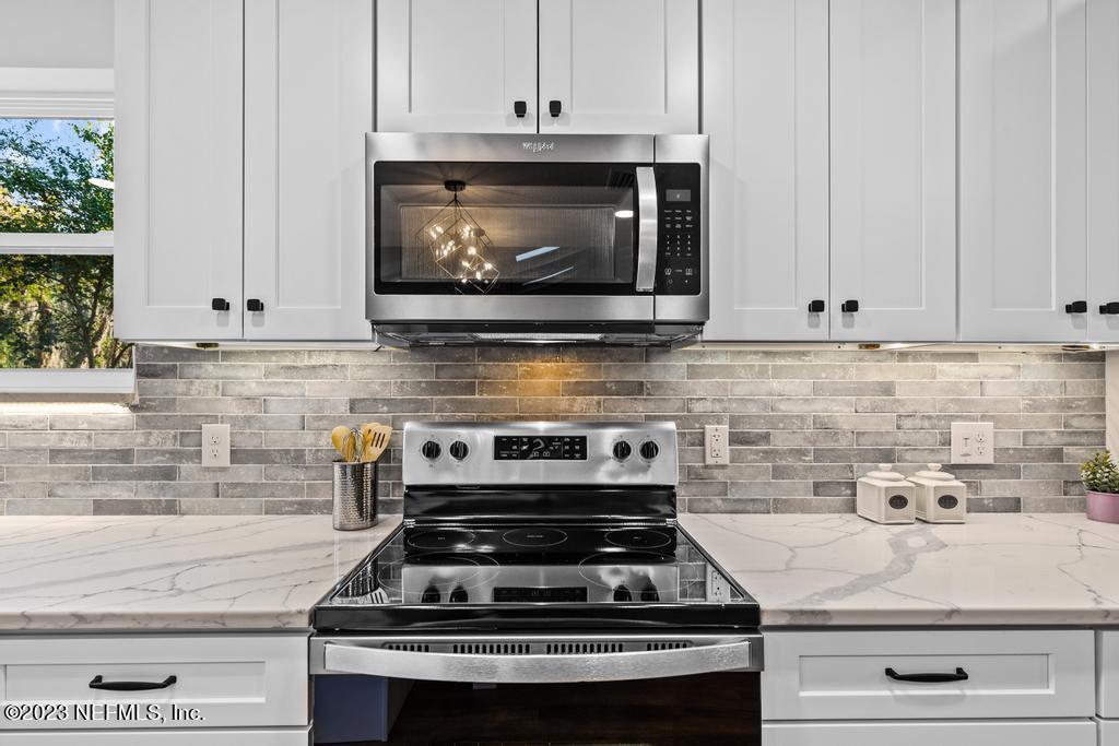 17 River Road Orange Park, FL 32073 - Photo 13 of 49 a stove top oven sitting inside of a kitchen