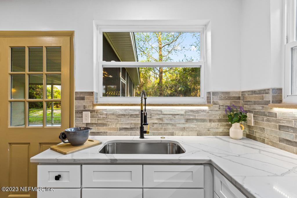 17 River Road Orange Park, FL 32073 - Photo 14 of 49 a kitchen with a sink and a window