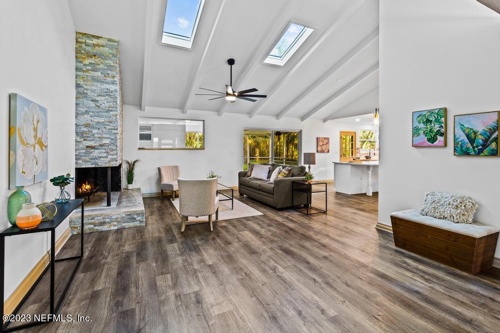 17 River Road Orange Park, FL 32073 - Photo 21 of 49 a living room with fireplace furniture and a wooden floor