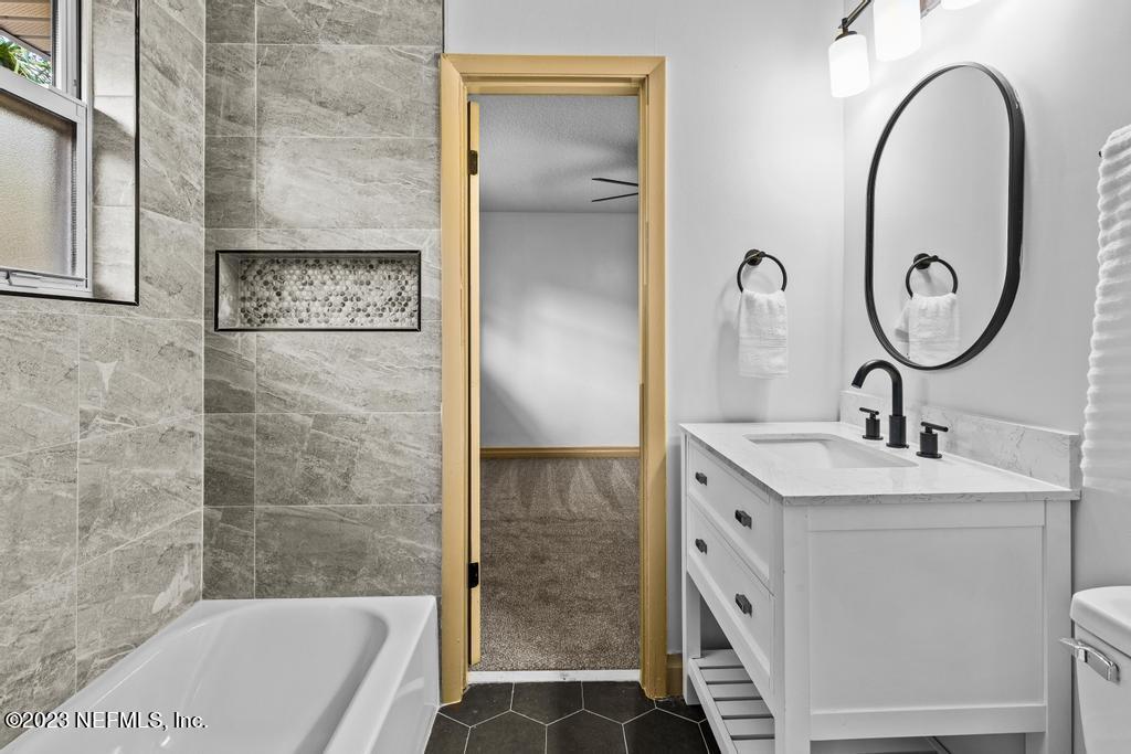 17 River Road Orange Park, FL 32073 - Photo 28 of 49 a bathroom with a double vanity sink mirror and bathtub