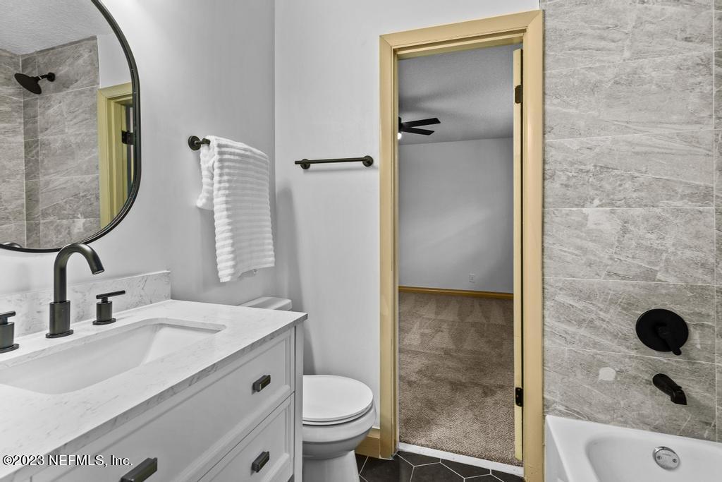 17 River Road Orange Park, FL 32073 - Photo 29 of 49 a bathroom with a sink and a mirror