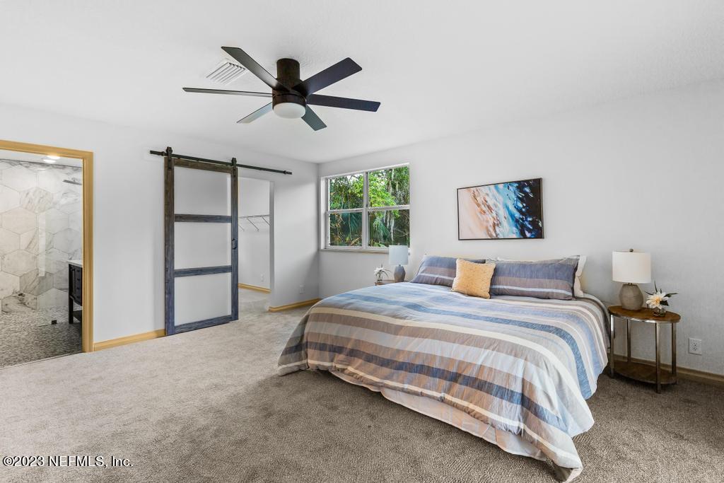 17 River Road Orange Park, FL 32073 - Photo 36 of 49 a bedroom with a bed and window