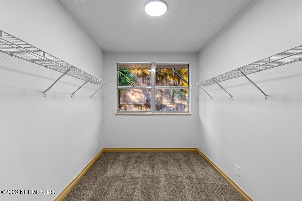 17 River Road Orange Park, FL 32073 - Photo 37 of 49 a view of small space with racks on the wall and a window