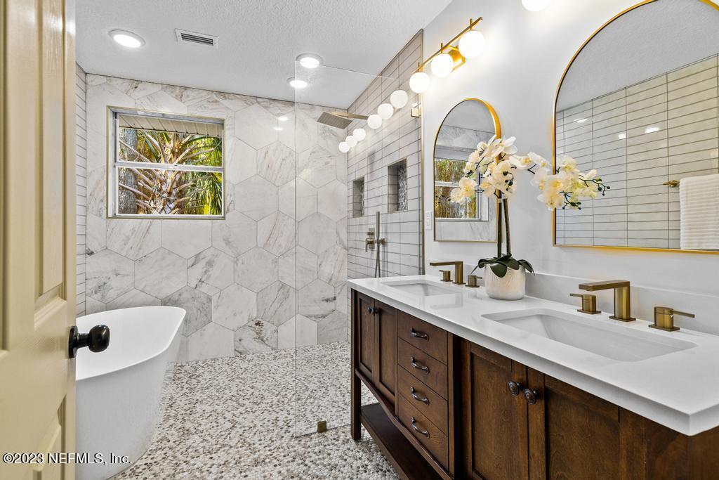 17 River Road Orange Park, FL 32073 - Photo 38 of 49 a bathroom with a double vanity sink mirror and bathtub