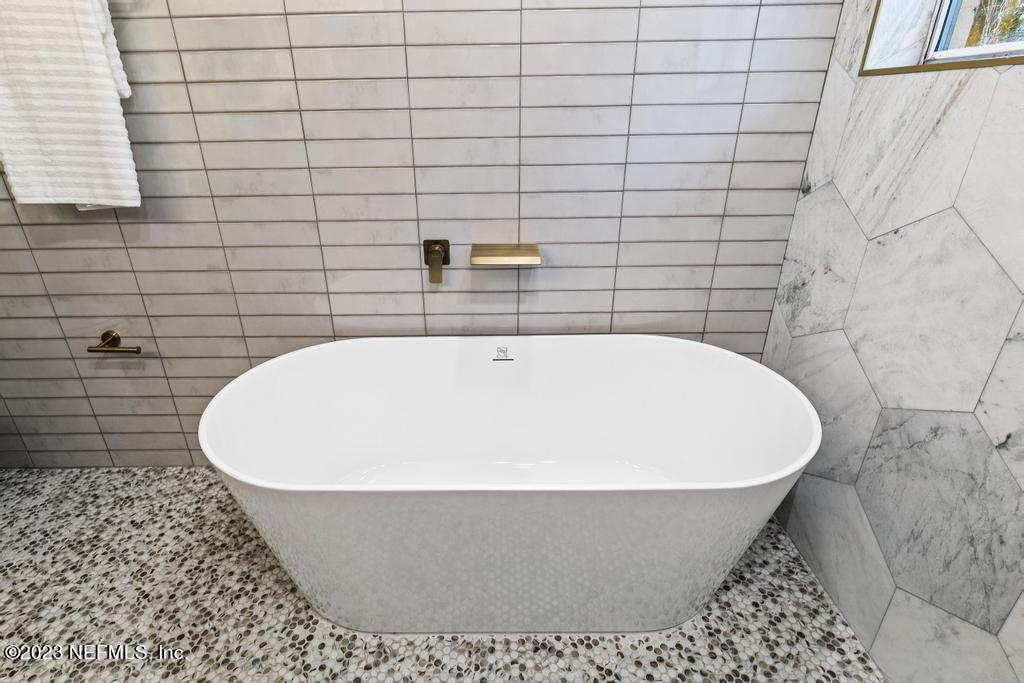 17 River Road Orange Park, FL 32073 - Photo 42 of 49 a white bath tub sitting in a bathroom