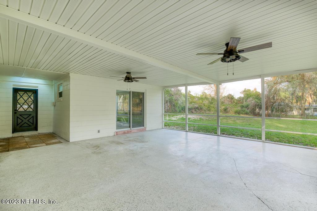 17 River Road Orange Park, FL 32073 - Photo 44 of 49 a view of an empty room with window and ceiling fan