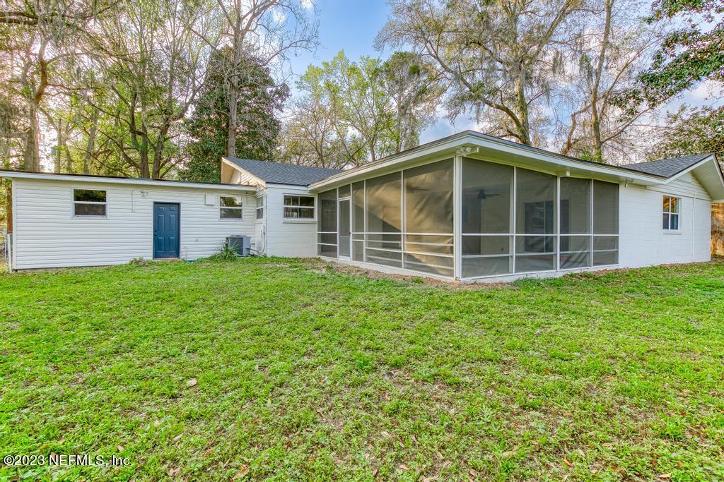 17 River Road Orange Park, FL 32073 - Photo 49 of 49 a front view of a house with a garden