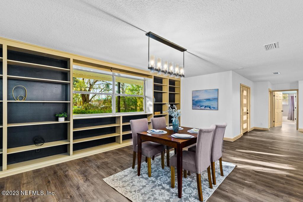 17 River Road Orange Park, FL 32073 - Photo 10 of 49 a view of a dining room with furniture window and wooden floor