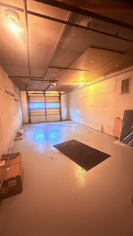 49 Melrose Street, Unit 1H Melrose, MA 02176 - Photo 16 of 20 a view of a room with gym equipment