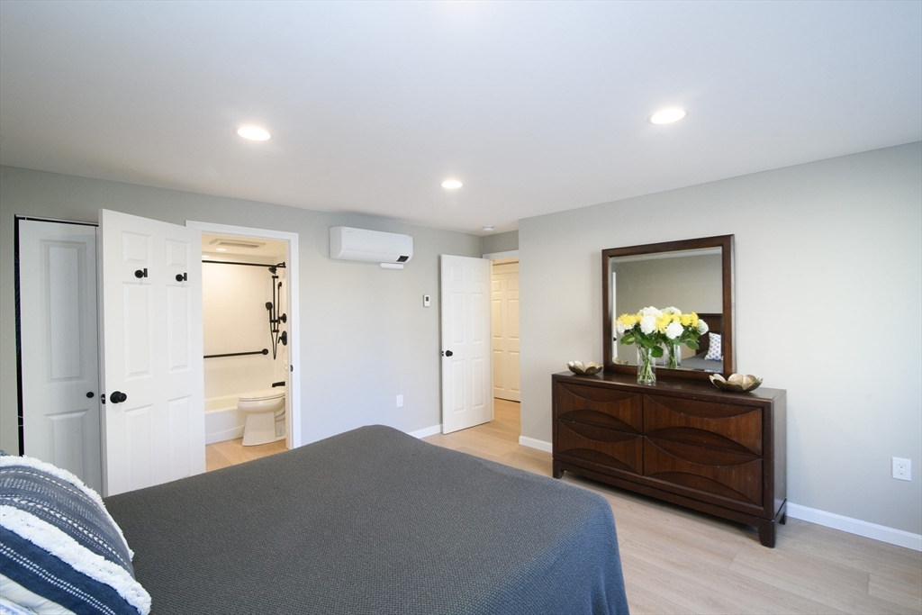 49 Melrose Street, Unit 1H Melrose, MA 02176 - Photo 9 of 20 a bedroom with a bed and a dresser